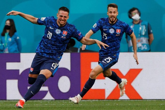 Robert Mak (L) runs off celebrating after his strike helped put Slovakia ahead