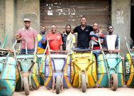 Man narrates how wheelbarrow pushing business has made him a millionaire with 20 employees