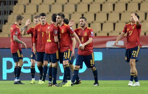 On target: Spain's players celebrate Ferran Torres' goal
