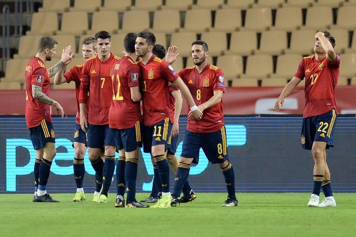 On target: Spain's players celebrate Ferran Torres' goal