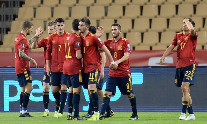On target: Spain's players celebrate Ferran Torres' goal