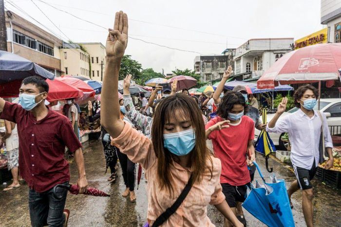 Protesters make the three-finger salute during a demonstration against the military coup in Yangon earlier this month