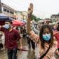 Protesters make the three-finger salute during a demonstration against the military coup in Yangon earlier this month