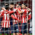 Atletico Madrid players celebrate one of their goals in a 3-1 win over Valencia in La Liga on Sunday