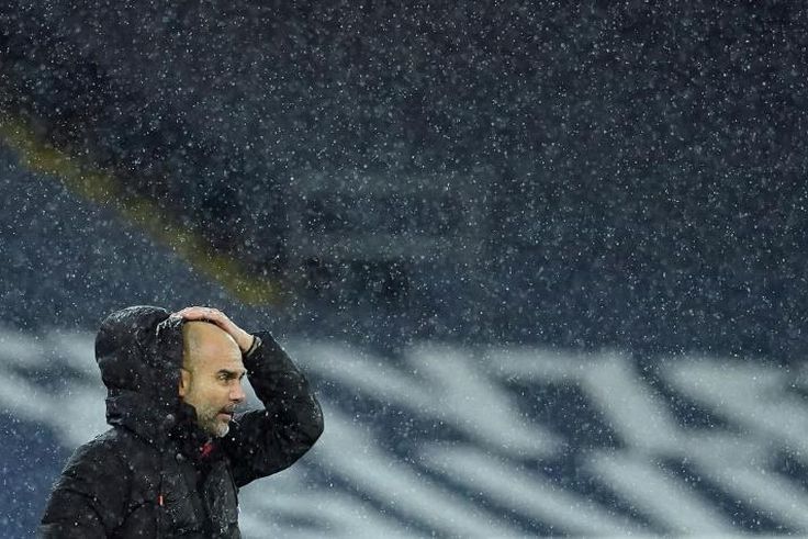 Pep Guardiola is soaked on the sidelines as Storm Bella battered the Etihad during Manchester City's win over Newcastle