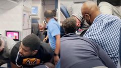 Passengers subdue unruly flight attendant as captain calls for help