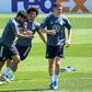 Germany defender Matthias Ginter (R) trains with Ilkay Gundogan (L) and Leroy Sane (C) on Thursday