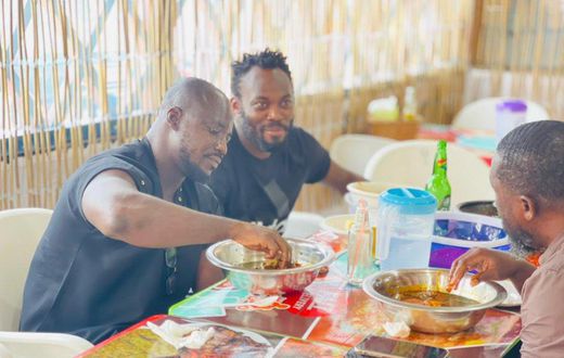 Fans in awe of Essien and Appiah as ex-Black Stars duo feast in chop bar