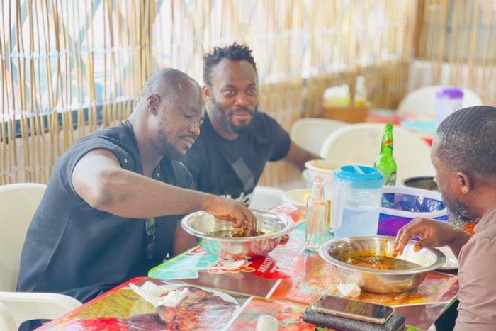 Fans in awe of Essien and Appiah as ex-Black Stars duo feast in chop bar