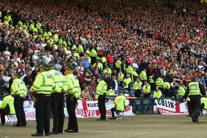Lines of police separate rival England and Scotland supporters