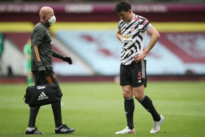 Manchester United captain Harry Maguire (right)is a major doubt for Wednesday's Europa League final due to an ankle injury