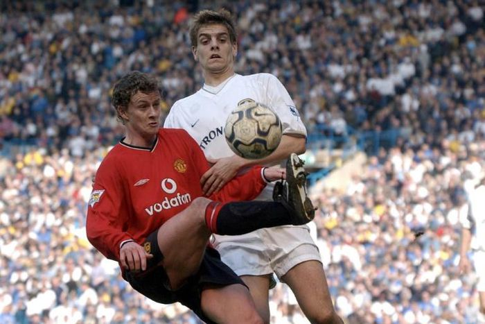 Ole Gunnar Solskjaer in action against Jonathan Woodgate of Leeds as a Manchester United player