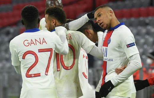 Kylian Mbappe (R) celebrates with his Paris Saint-Germain team-mates after scoring his second goal against Bayern Munich on Wednesday