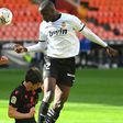 Valencia's French defender Mouctar Diakhaby (right) seen here playing against Real Sociedad walked off the pitch in the game against Cadiz
