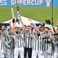 Captain Giorgio Chiellini (C) lifts the trophy after Juventus beat Napoli to win the Italian Super Cup