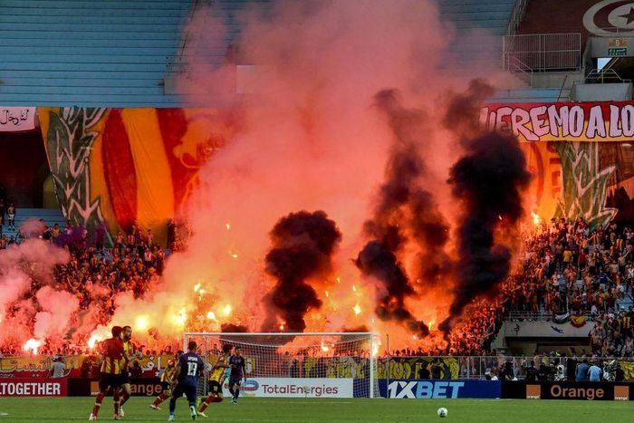 Esperance of Tunisia supporters light flares during the first leg of a CAF Champions League semi-final against Al Ahly of Egypt in Rades on Saturday.
