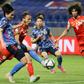 Japan forward Takumi Minamino (L)