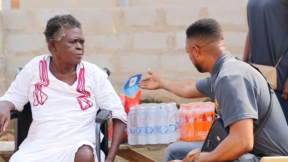 Lance Corporal Simon Agbeko gives to the aged
