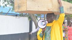 Archbishop Samson Benjamin embarks on a one-man protest with a coffin on his head