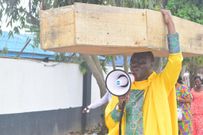 Archbishop Samson Benjamin embarks on a one-man protest with a coffin on his head