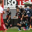 Bayern Munich striker Robert Lewandowski (L) celebrates scoring his 40th Bundesliga goal this season to equal Gerd Mueller's 49-year-old record