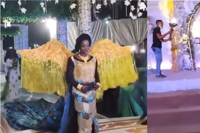 African print-wearing bride's angelic entrance into wedding venue