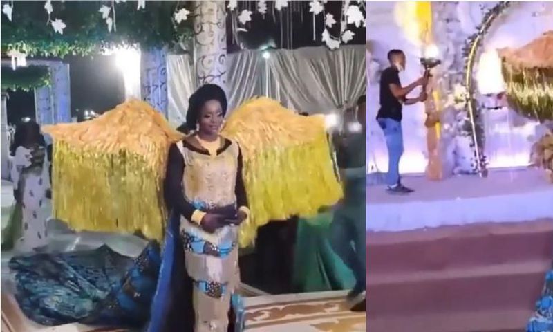 African print-wearing bride's angelic entrance into wedding venue