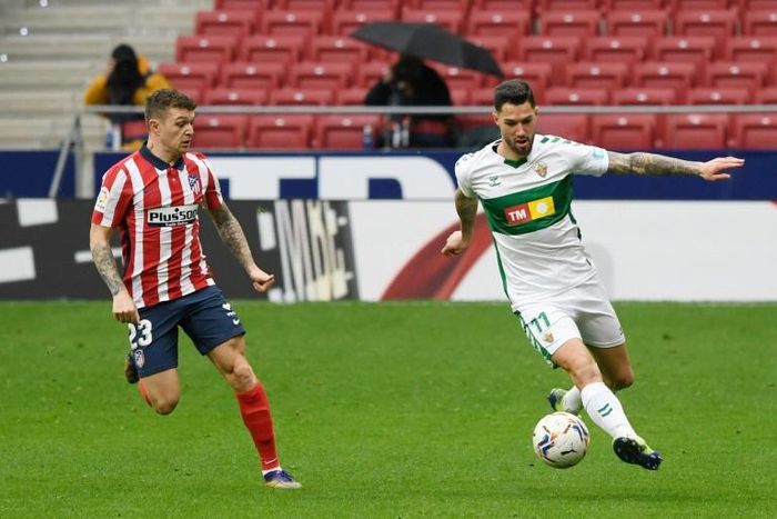 Atletico Madrid's English defender Kieran Trippier (left)