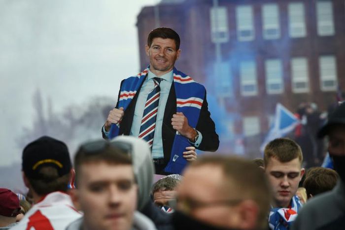 Rangers fans celebrate winning the Scottish Premiership outside Ibrox Stadium in Glasgow