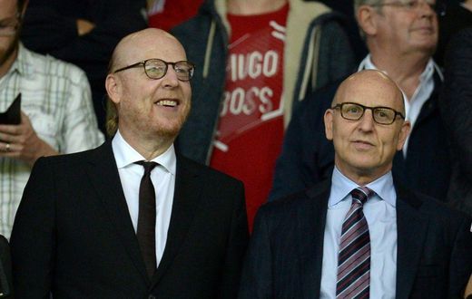 Manchester United co-chairman Joel Glazer (R) with his brother and fellow owner Avram Glazer (L)