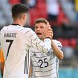 Kai Havertz (L) and Thomas Mueller (R) celebrate Germany's opening goal against Portugal