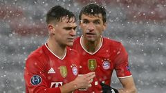 Bayern Munich midfielder Joshua Kimmich (L) is convinced the holders can still reach the Champions League semi-finals