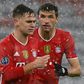Bayern Munich midfielder Joshua Kimmich (L) is convinced the holders can still reach the Champions League semi-finals