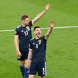High fives: Scotland earned a 0-0 draw away to England to keep their Euro 2020 hopes alive