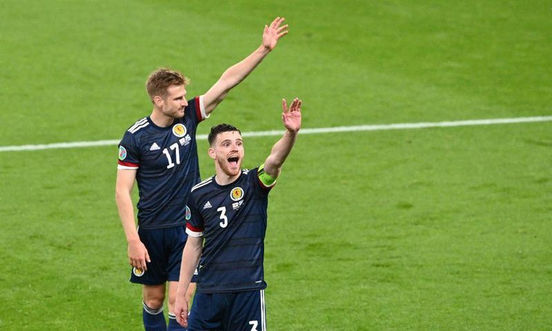 High fives: Scotland earned a 0-0 draw away to England to keep their Euro 2020 hopes alive