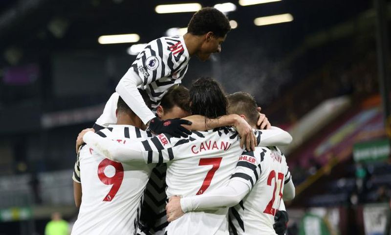 Manchester United midfielder Paul Pogba is mobbed by teammates after scoring against Burnley