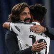Dybala celebrates with coach Andrea Pirlo (L) after scoring his first league goal in five months