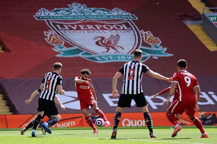 Mohamed Salah (2L) puts Liverpool ahead in a 1-1 draw against Newcastle United at Anfield