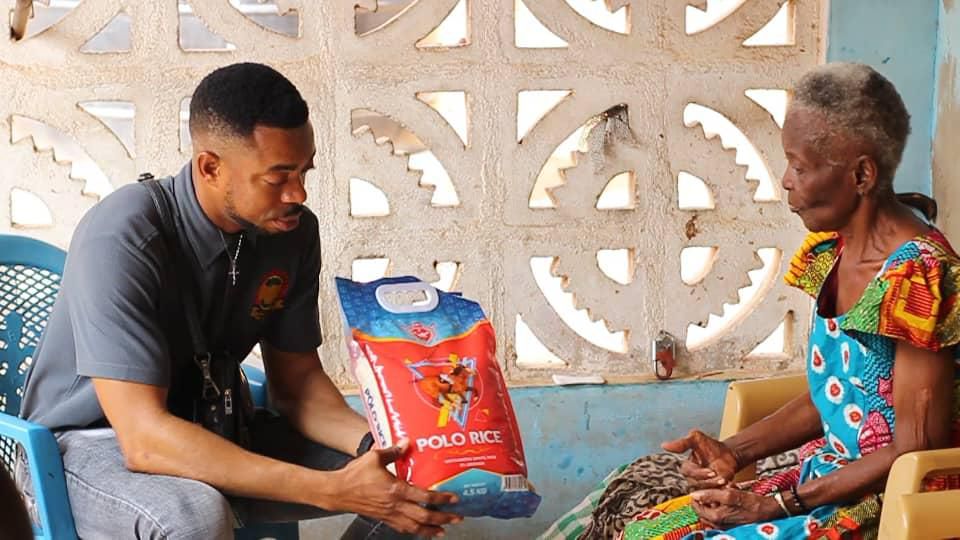 Lance Corporal Simon Agbeko gives to the aged