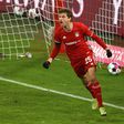 Thomas Mueller celebrates scoring the equaliser as Bayern Munich drew 3-3 at home with RB Leipzig on Saturday