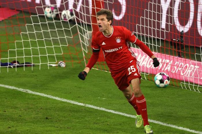 Thomas Mueller celebrates scoring the equaliser as Bayern Munich drew 3-3 at home with RB Leipzig on Saturday
