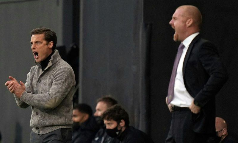 Going down, staying up - Rival managers Scott Parker (Fulham, L) and and Sean Dyche (Burnley R) urge their sides on during a x-x win for Burnley that saw Fulham relegated from the Premier League