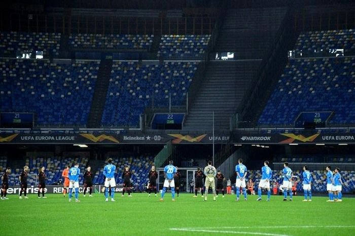 Players hold a minute's silence for Italy's 1982 World Cup winner Paolo Rossi in their first match at the renamed Diego Armando Maradona stadium in Naples.