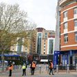 Security guards stand with stewards outside Chelsea's Stamford Bridge stadium