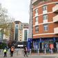 Security guards stand with stewards outside Chelsea's Stamford Bridge stadium