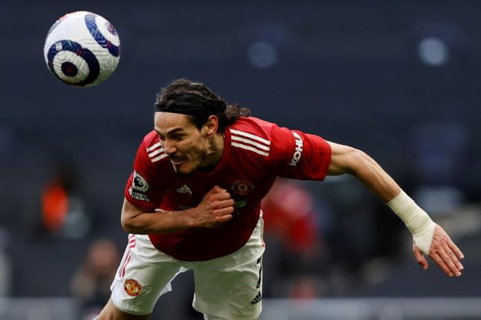 Eyes on the prize: Edinson Cavani's header helped Manchester United beat Tottenham 3-1 on Sunday