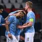 Manchester City players congratulate Riyad Mahrez after his free-kick gave the English side a 2-1 win in Paris