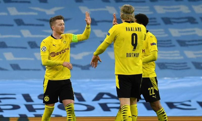 Borussia Dortmund captain Marco Reus (L) celebrates his goal at Manchester City in Tuesday's 2-1 away defeat