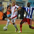 Anthony Laffor (R) playing for Liberia against Tunisia in an Africa Cup of Nations qualifier