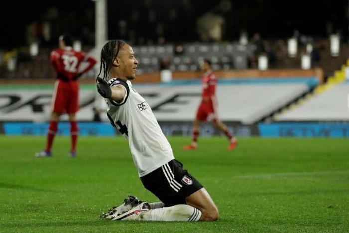 Bobby Decordova-Reid (centre) scored Fulham's goal in a 1-1 draw with Liverpool on Sunday